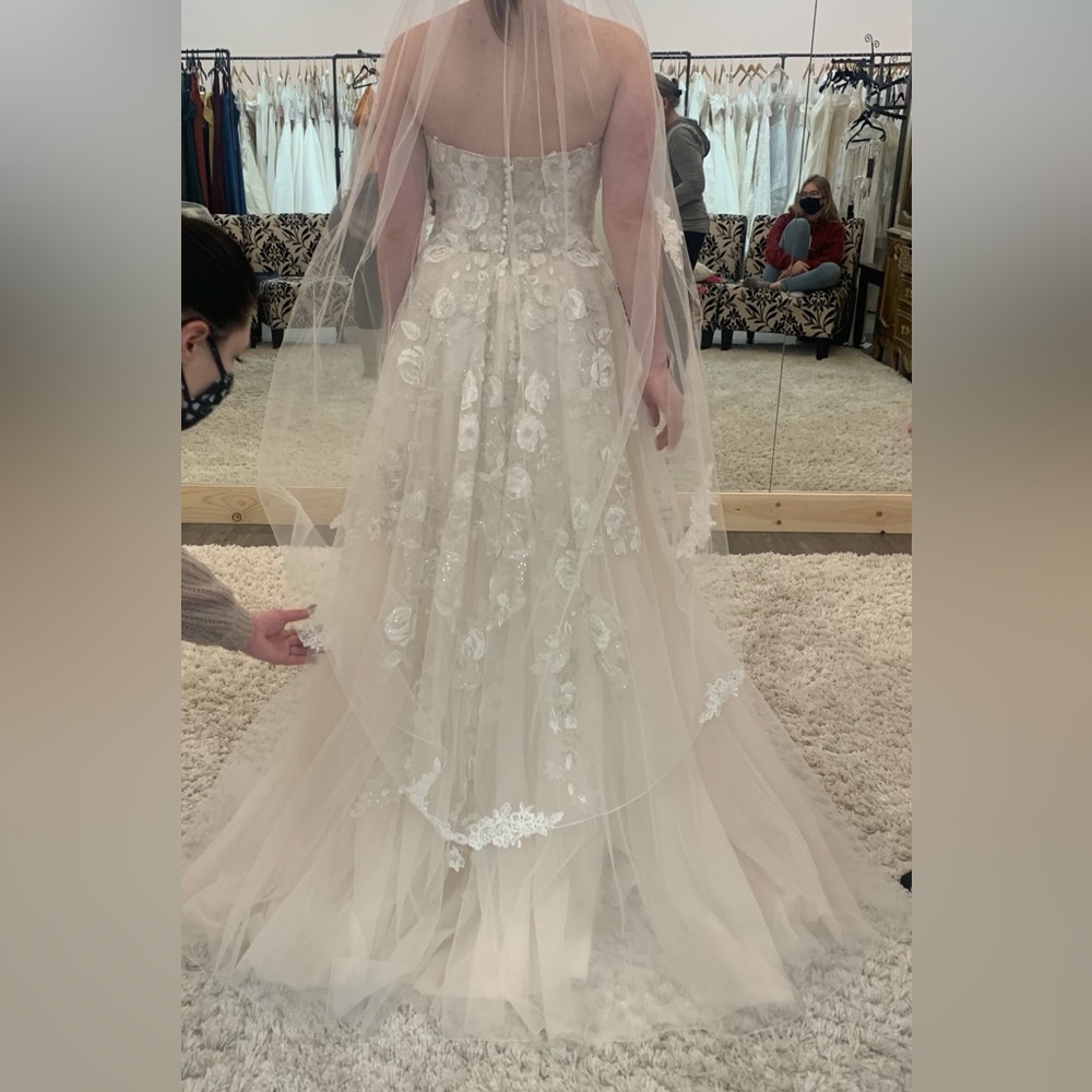 Serenity wedding dress, never used,off white color with beautiful lace detailing